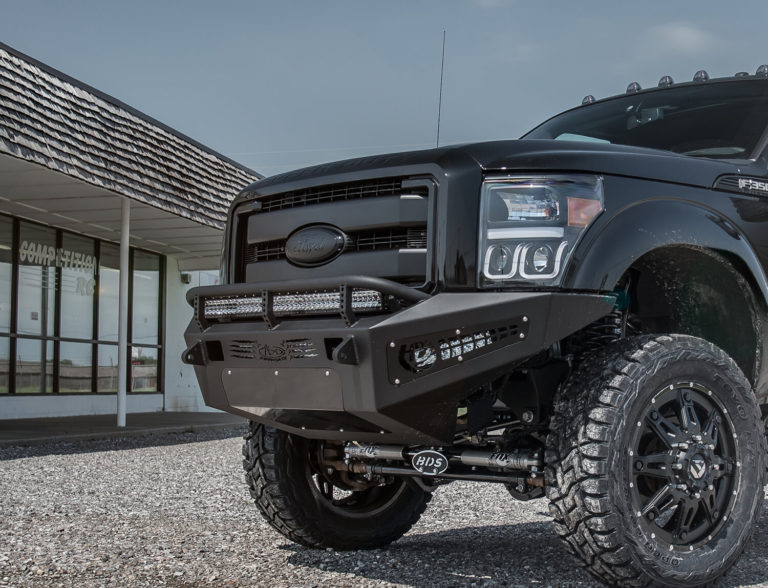 2011 - 2016 Ford F-250/350 HoneyBadger Front bumper with 40" LED bar mounts and 20" LED bar mounts in front with HB logo cutout with 10" LED bar mounts in side panels in Hammer Black with Satin Black panels