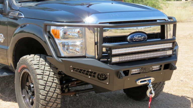 2011 - 2016 Ford F-250/350 HoneyBadger Front Rancher bumper with Winch Mounts and Dual 40" LED bar mounts and 20" LED bar mounts in front with HB logo cutout with 10" LED bar mounts in side panels in Hammer Black with Satin Black panels