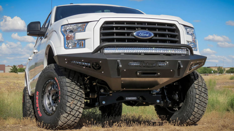 Ford F-150 HoneyBadger Front Winch Bumper with Upper 40" Radius LED Bar Mount and Lower 20" LED Bar Mount in Front with HB Logo Cutout with 10" LED Bar Mounts and Dually Mounts in Side Panels in Hammer Black with Satin Black Panels