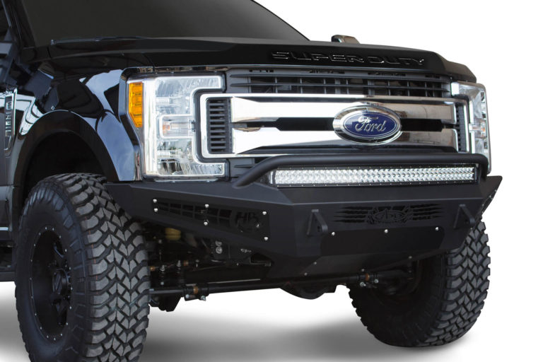 Ford F250 2017 - up HoneyBadger Front Bumper with HB logo cutout and 10 dually mounts/universal plate on top and 20" Universal LED bar mounts in center and 10" SR mounts in side panels in Hammer Black and Satin Black Panels