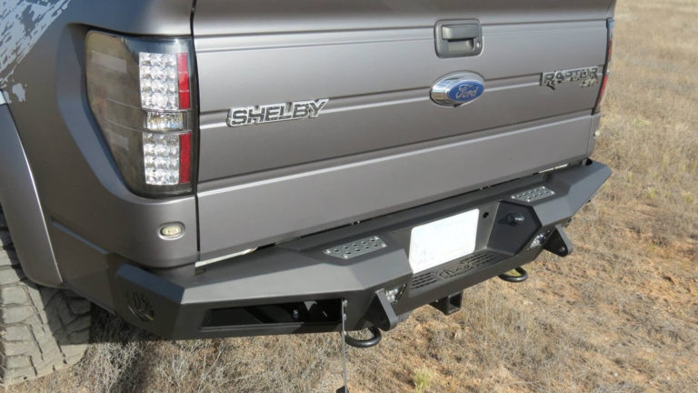 2010 - 2014 Ford Raptor / 2009 - 2014 Ford F-150 / 2011 - 2014 Ford Ecoboost F-150 HoneyBadger Rear Bumper with Integrated Storage Box and Tow Hooks and NO BACKUP SENSORS with Dually mounts in Hammer Black with Satin Black panels.