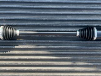 The ArmorTech CV Axle Heavy Duty for CFMoto ZForce 800 (2014-17), right front, is black with metal splined ends, silver clamps on rubber boots, and is shown horizontally on a ridged dark surface.